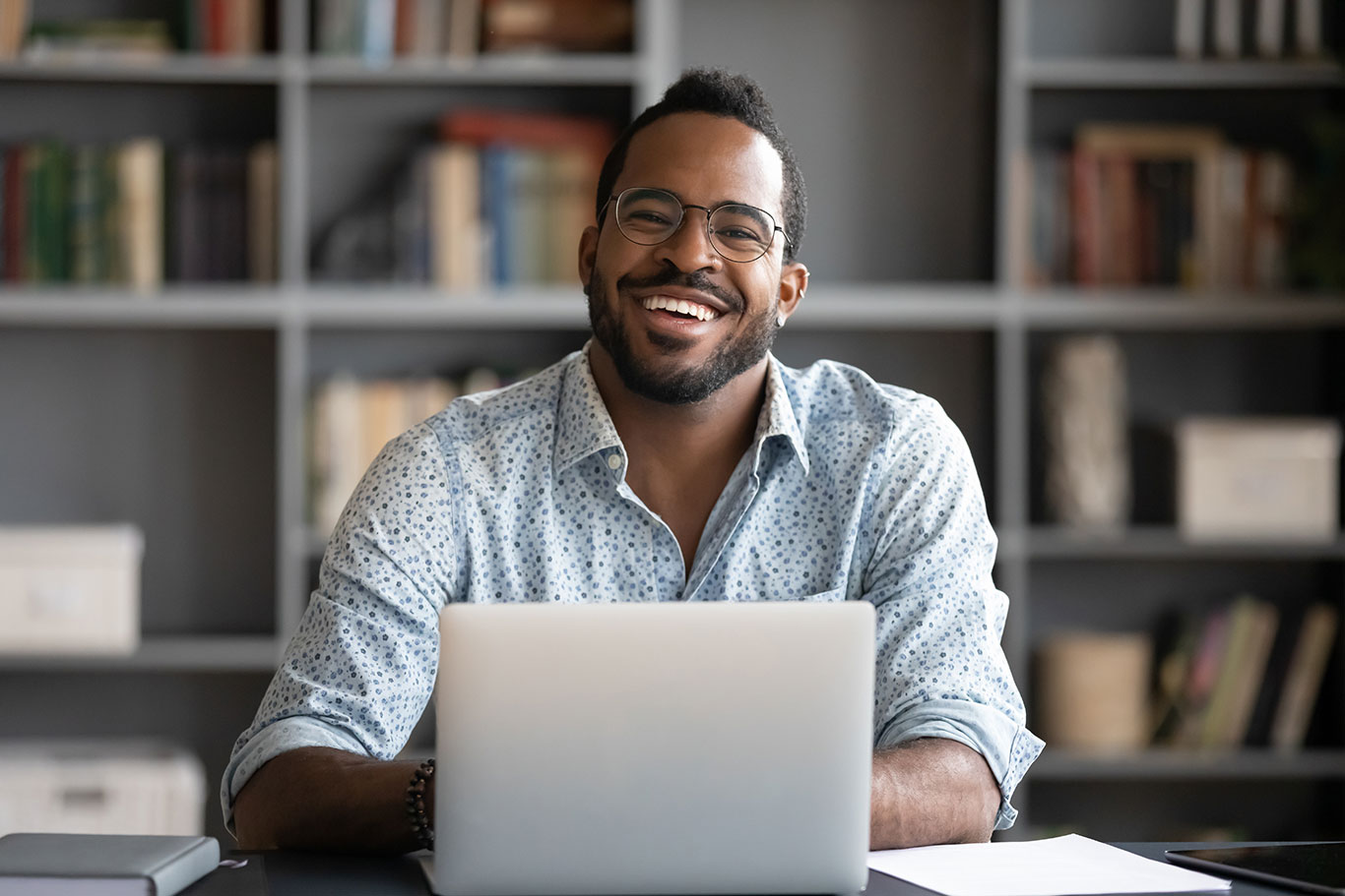 man reading news on his laptop