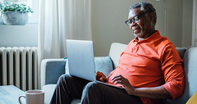 Man with laptop on lap