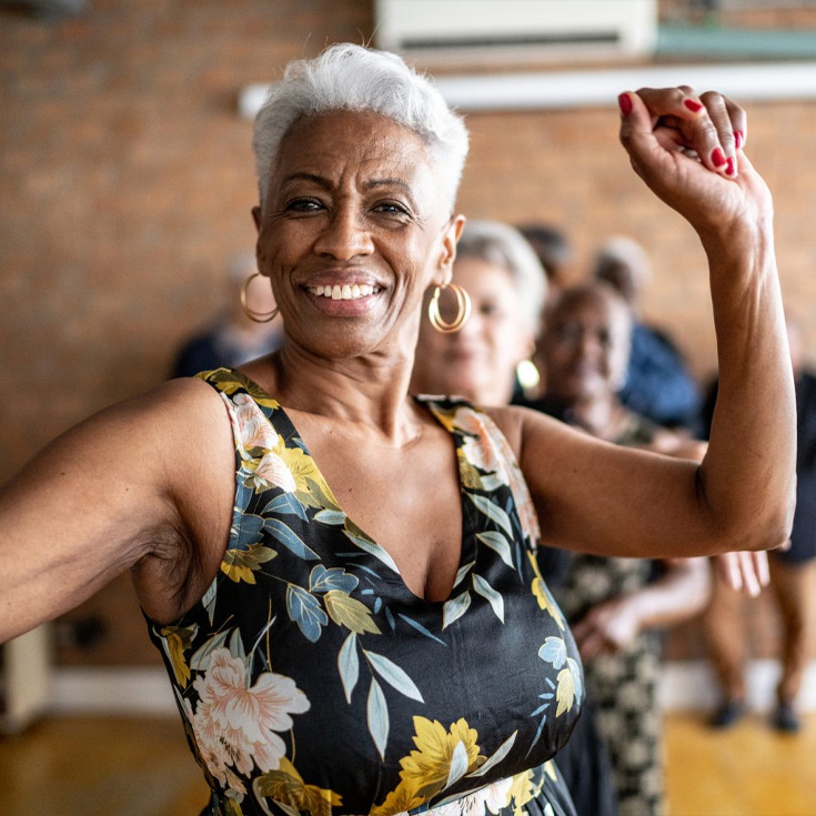 A mature woman in a dance class