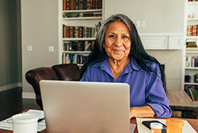 Native American woman on laptop